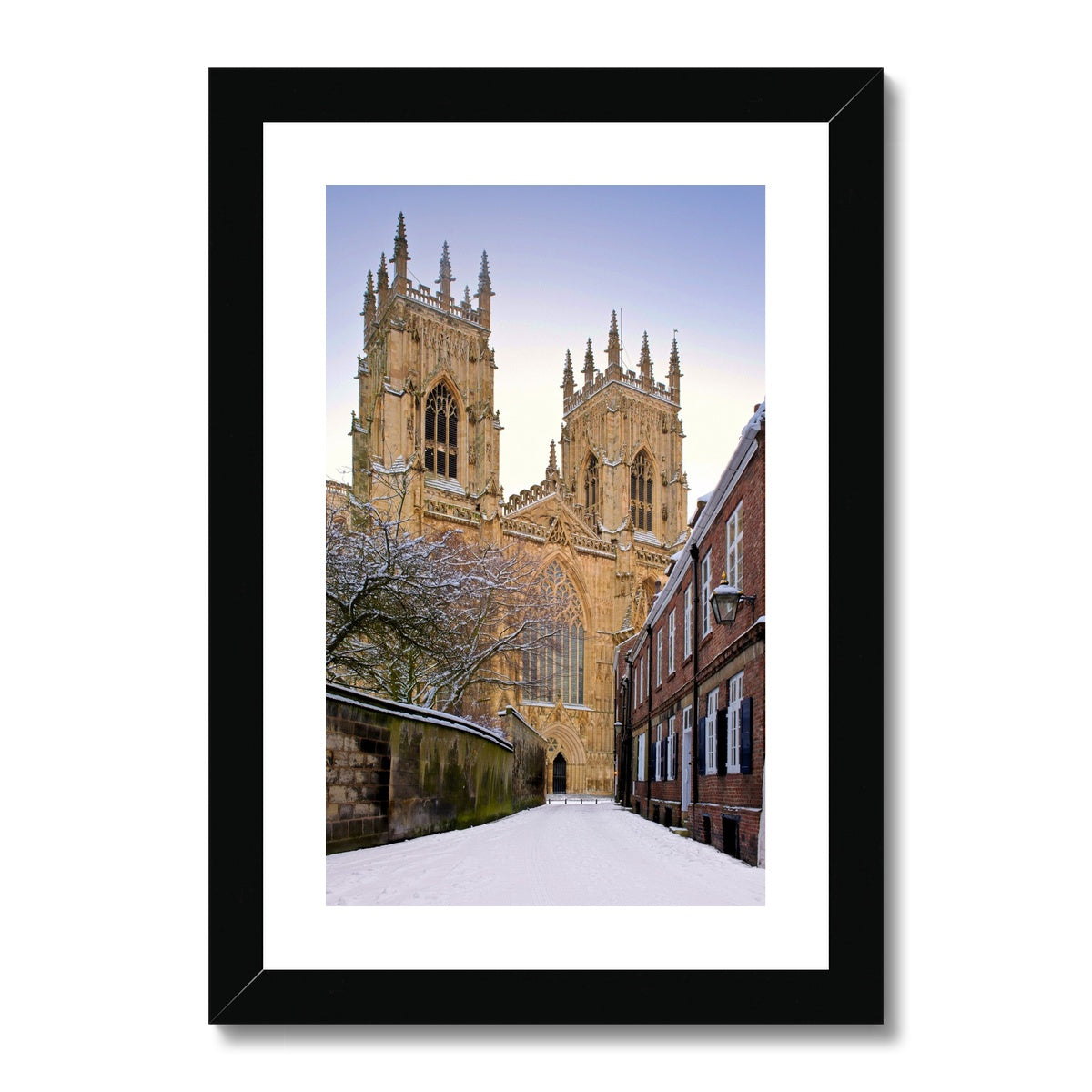 York Minster in the snow seen from Precentors Court. York, UK. Framed & Mounted Print