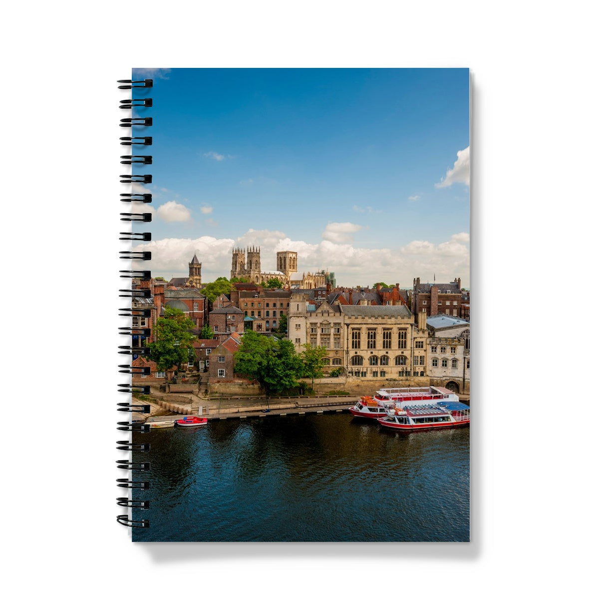 Moored boats on the River Ouse with the Guildhall and York Minster in the distance. York. UK Notebook