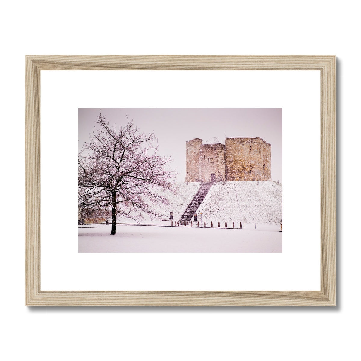 Clifford's Tower in snow blizzard, York, UK Framed & Mounted Print