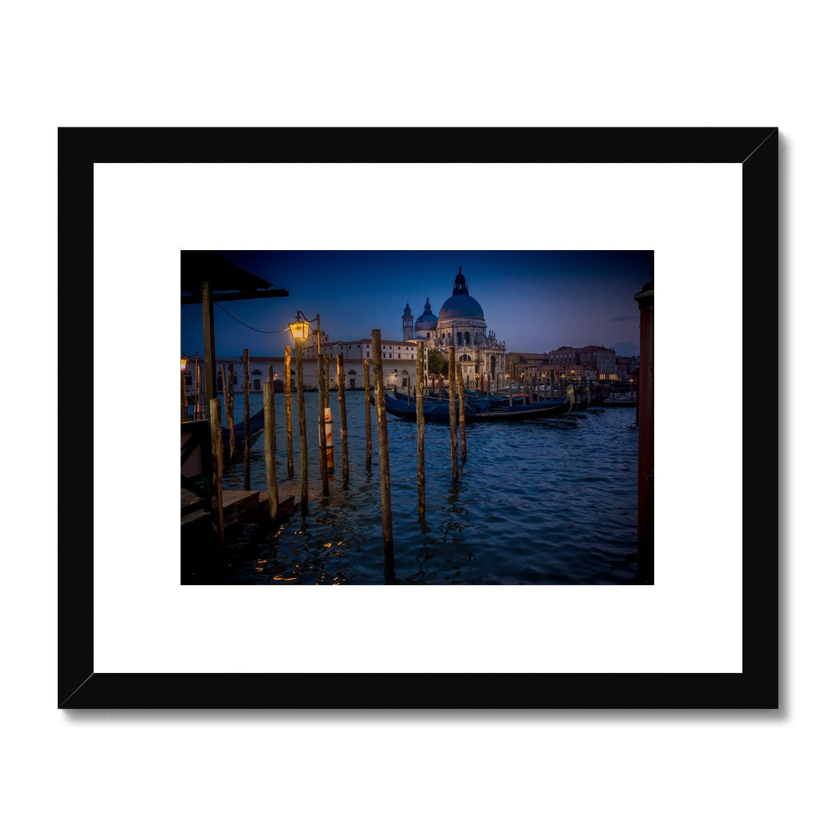 Gondolas moored for the night on the Grand Canal with the church of Santa Maria della Salute in the background. Venice, Italy. - Framed & Mounted Print