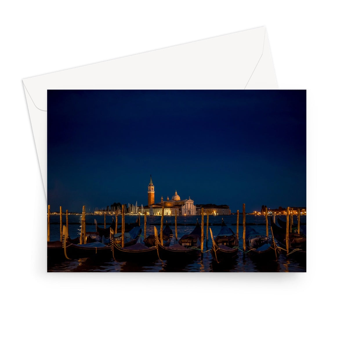 Gondolas moored in St Mark's Basin with San Giorgio Maggiore in the background at night, Venice, Italy. Greeting Card