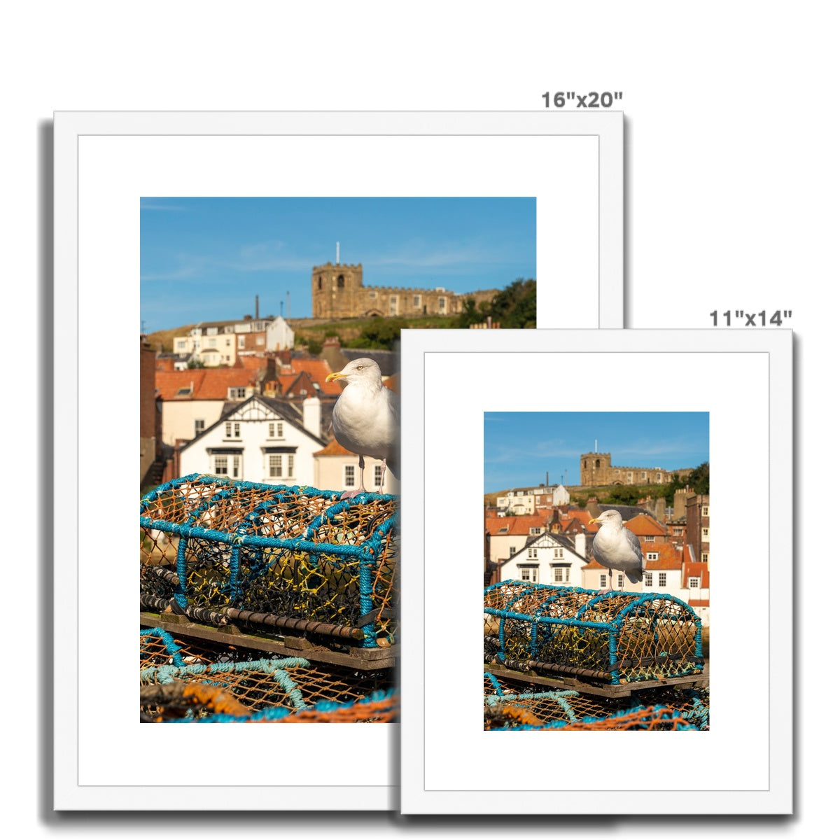 Seagull standing on a lobster trap on the quayside of Whitby harbour with St Mary's church in the distance. Whitby, UK. Framed & Mounted Print