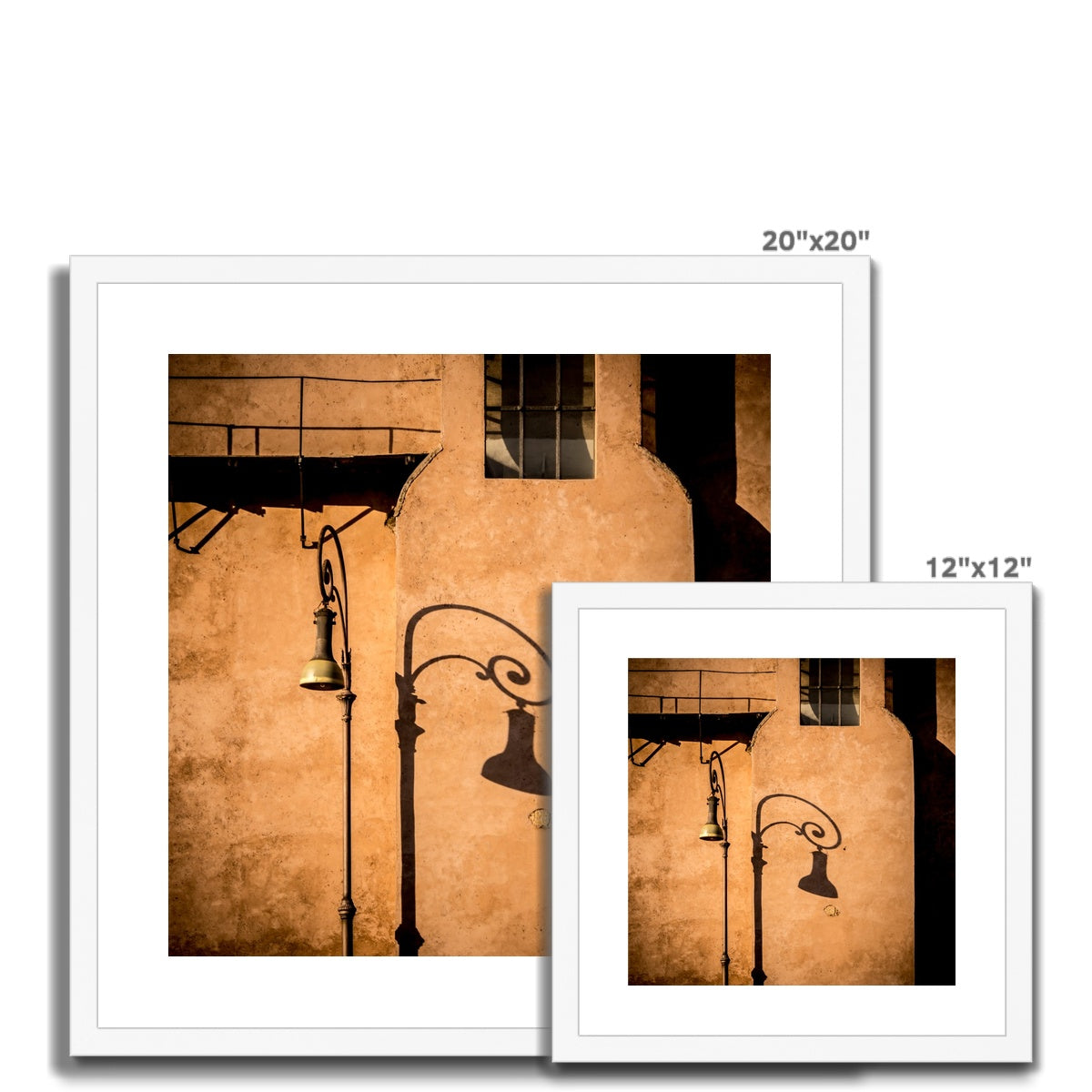 Street lamp and shadow on rendered building wall, Rome, Italy. Framed & Mounted Print