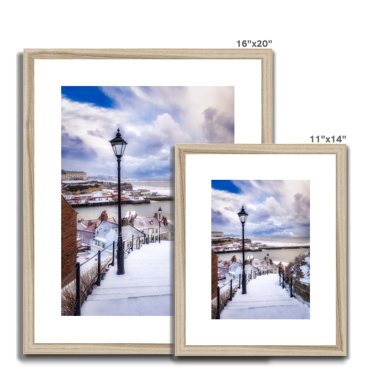 Snow covered steps leading down from St Mary's Church, Whitby, UK. Framed & Mounted Print