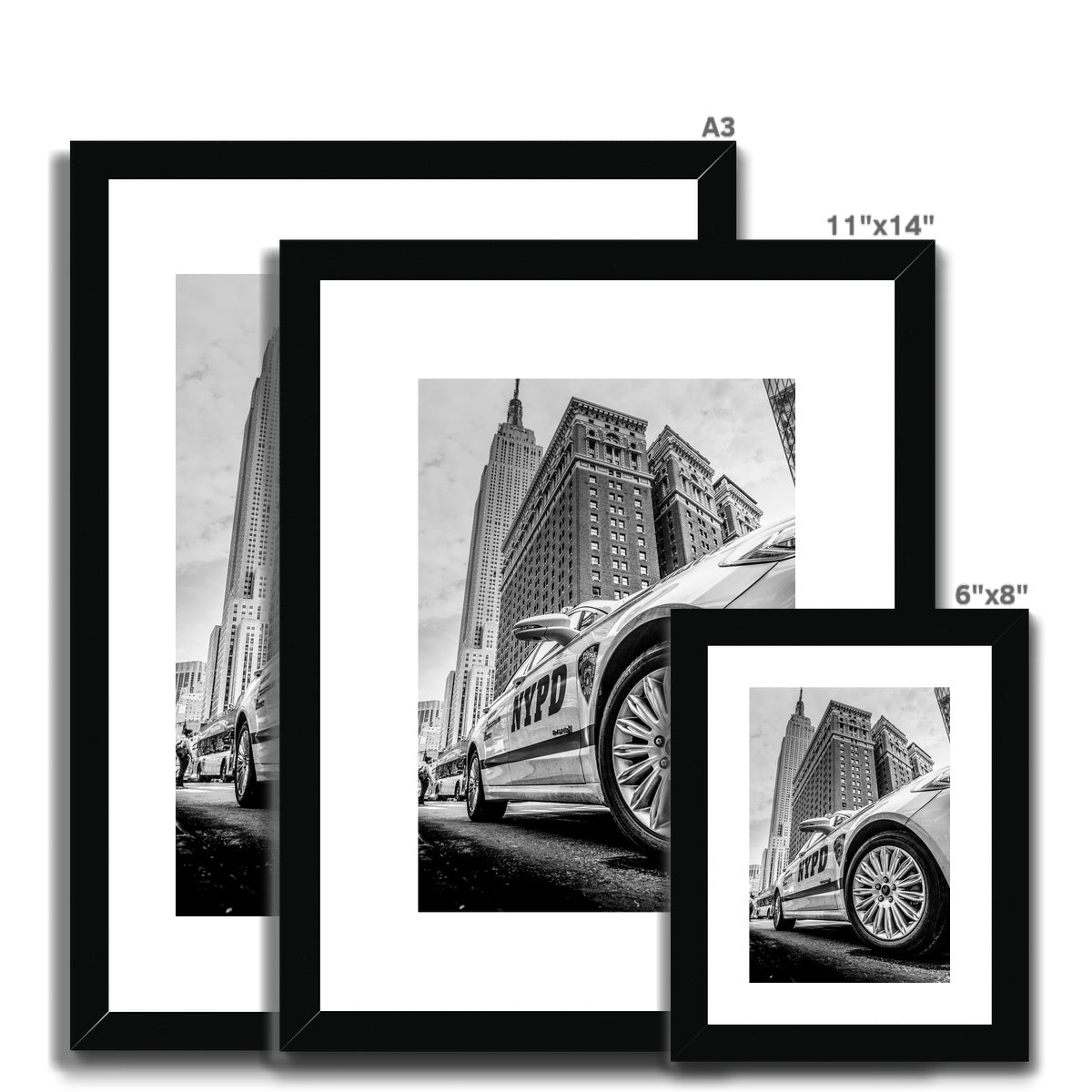 NYPD patrol car with Empire State Building on W 34th St, New York City, USA. Framed & Mounted Print