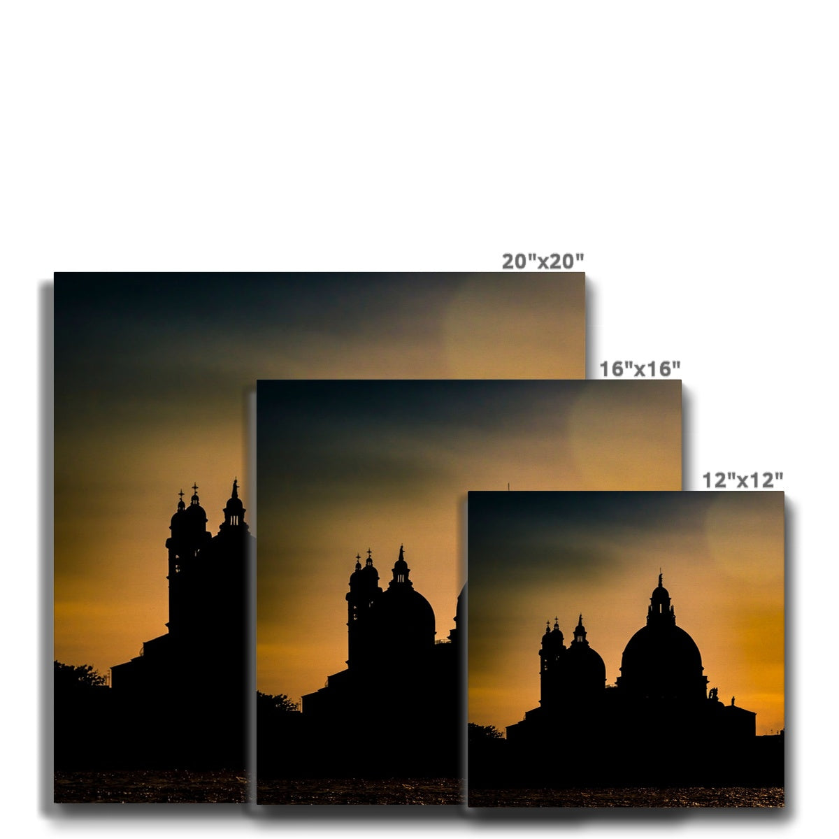 Silhouette of Santa Maria della Salute on the Grand Canal in Venice against a golden sky at sunset. Italy. Canvas
