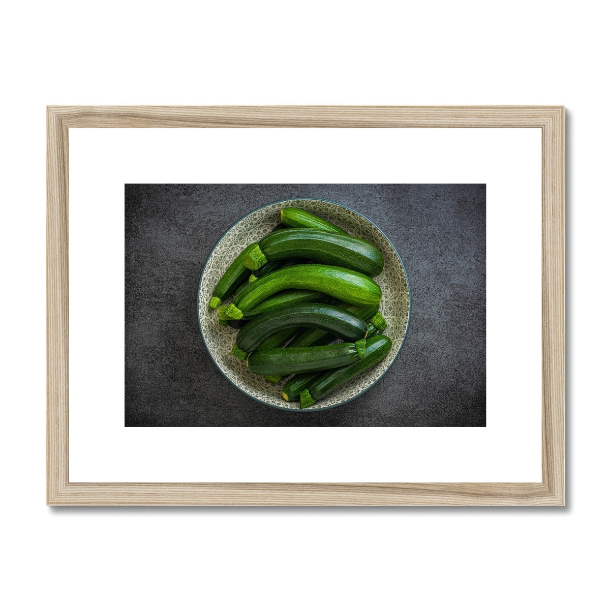 Bowl of green courgettes Framed & Mounted Print