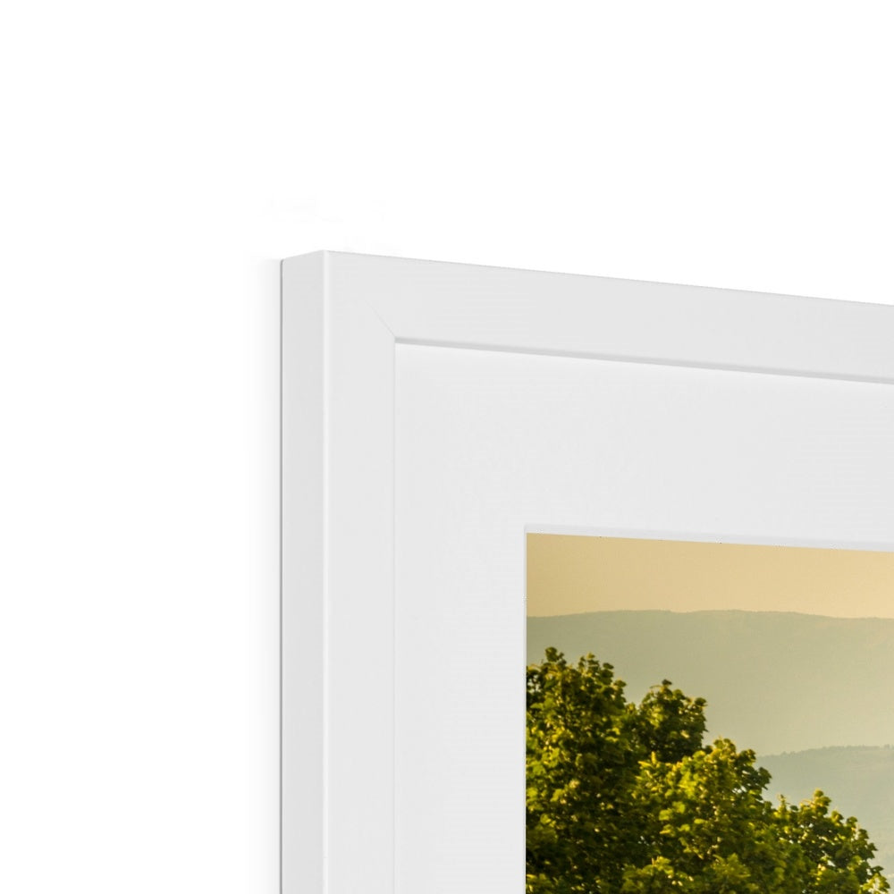 The south façade of Florence Cathedral glimpsed through the trees of San Miniato al Monte.  Italy. Framed & Mounted Print