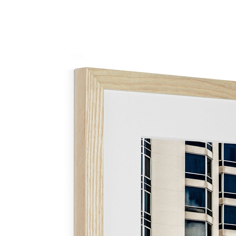 Symmetrical pattern of windows on contemporary skyscraper Framed & Mounted Print
