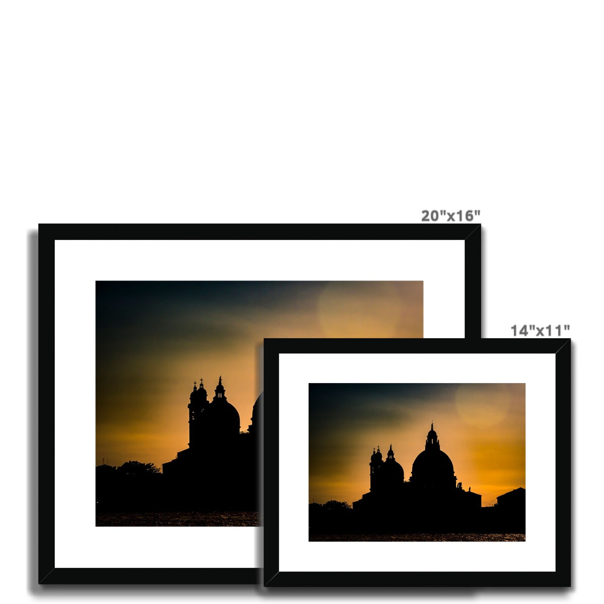 Silhouette of Santa Maria della Salute on the Grand Canal in Venice against a golden sky at sunset. Italy. Framed & Mounted Print
