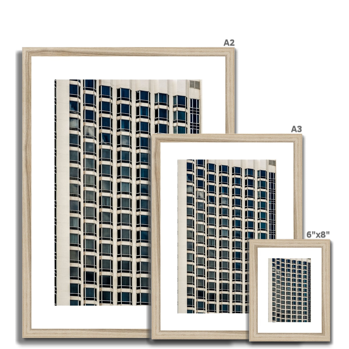 Symmetrical pattern of windows on contemporary skyscraper Framed & Mounted Print