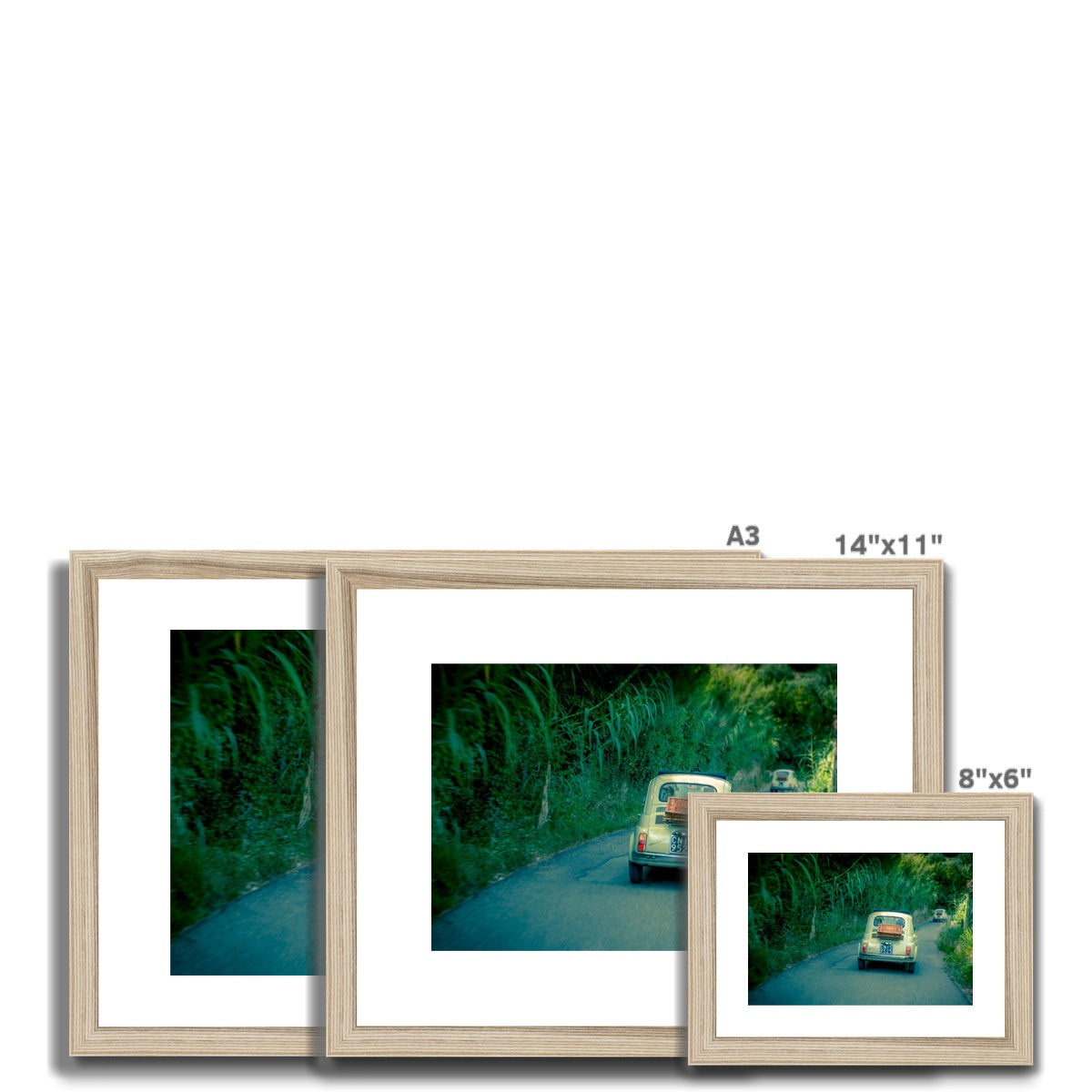 Classic Fiat 500 cars driving on a road in Florence, Italy.  Framed & Mounted Print