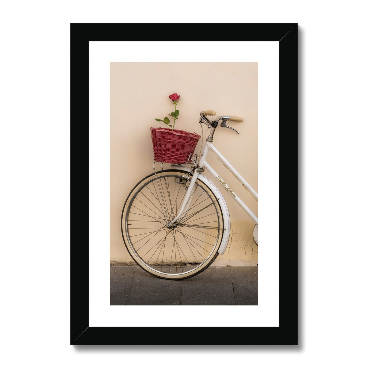 White bicycle parked against a  rendered wall with a red rose in its basket, Rome, Italy. Framed & Mounted Print