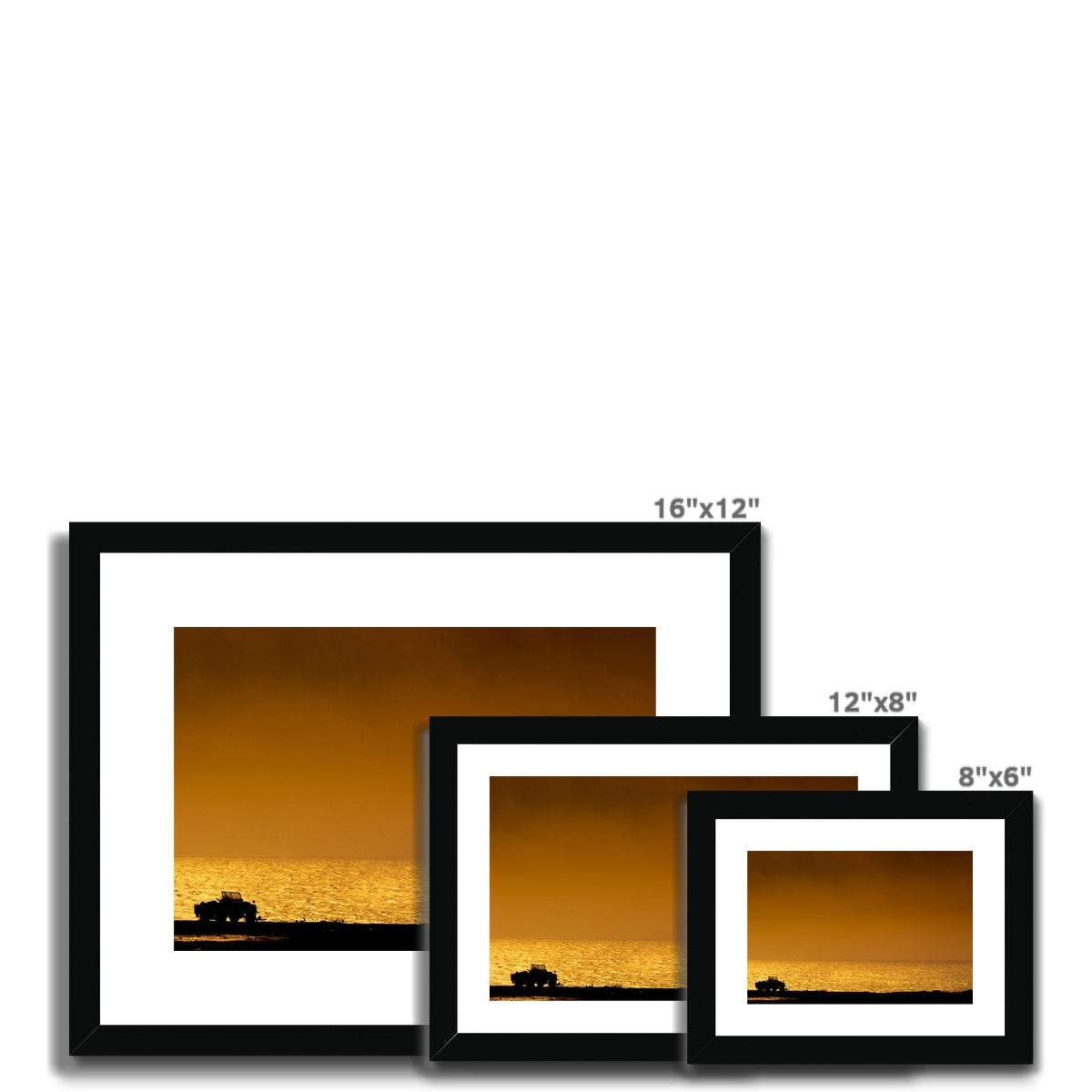 Silhouette of jeep on beach at sunset Framed & Mounted Print