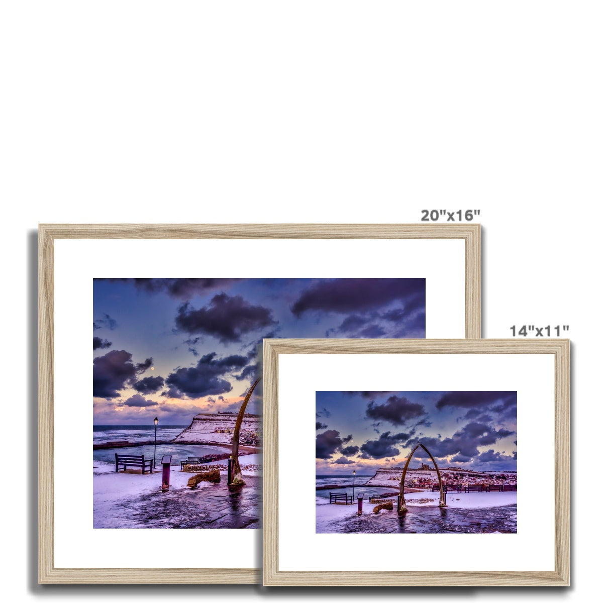 Whalebone Arch and view of Whitby Abbey in snow, Whitby, UK. Framed & Mounted Print