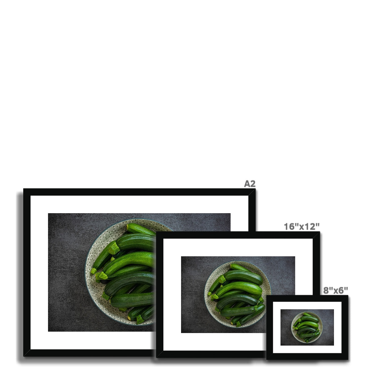 Bowl of green courgettes Framed & Mounted Print