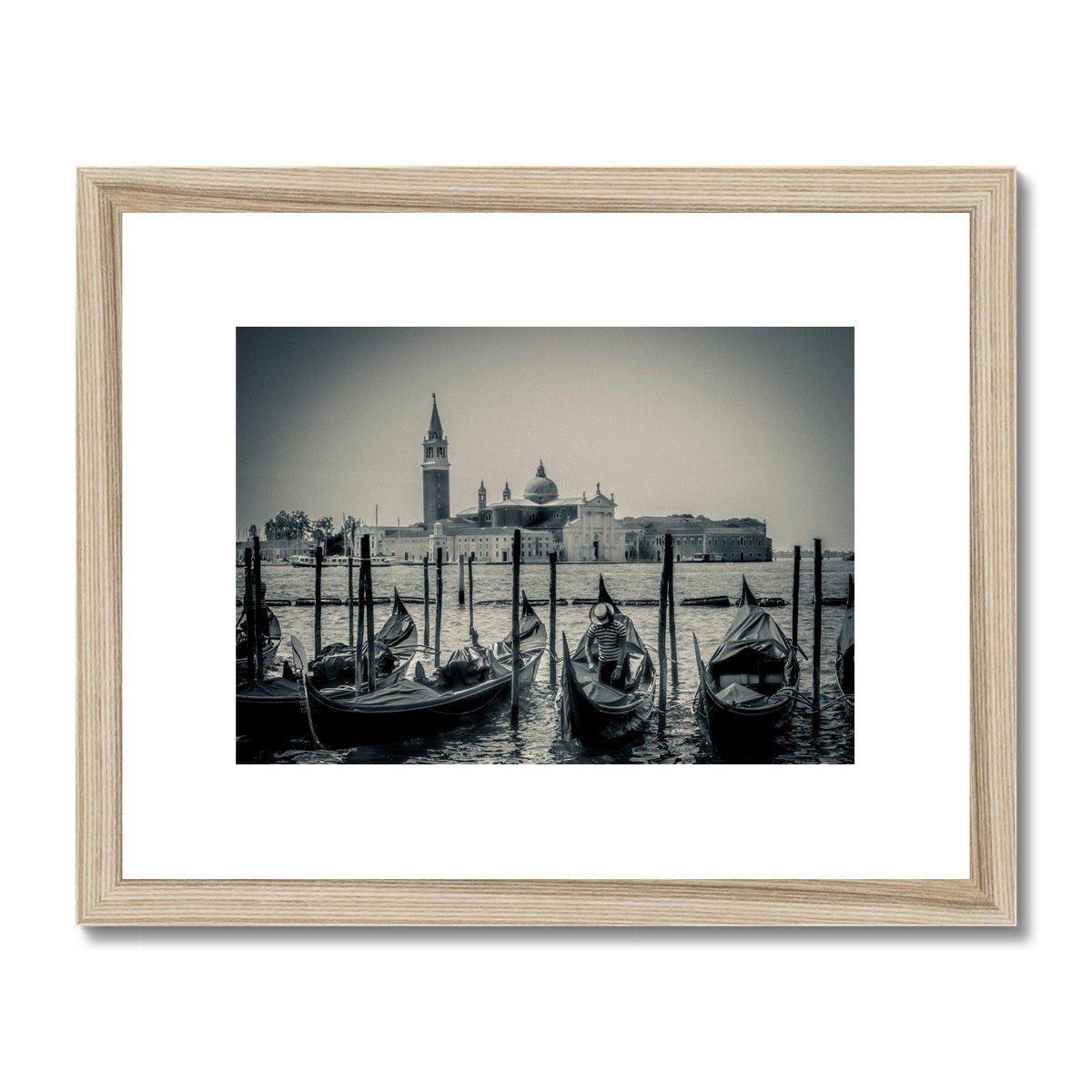 Gondolas moored in St Mark's Basin with San Giorgio Maggiore in the background. Venice, Italy. Framed & Mounted Print