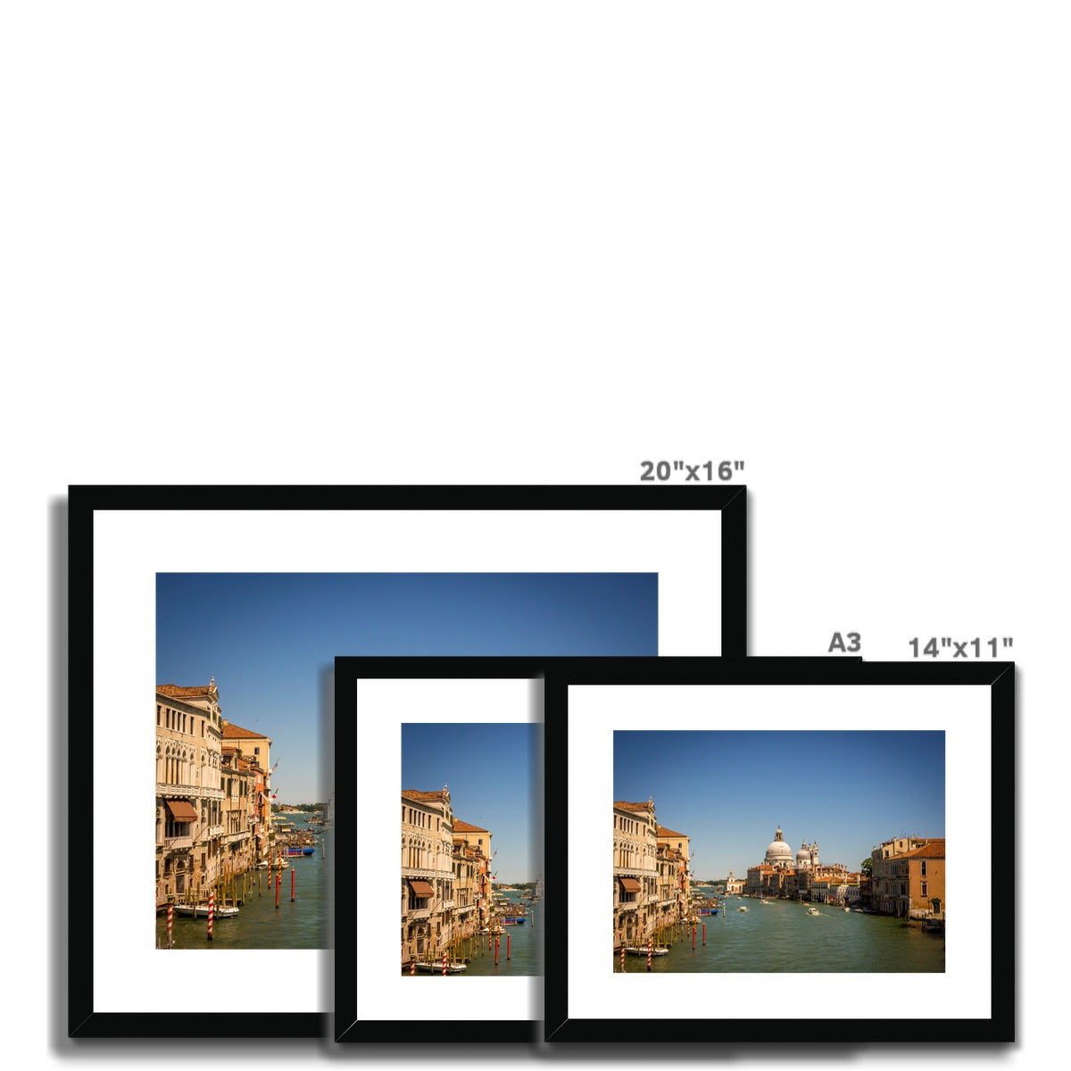 Grand canal in Venice with the domes of the church Santa Maria della  Salute in the distance Framed & Mounted Print