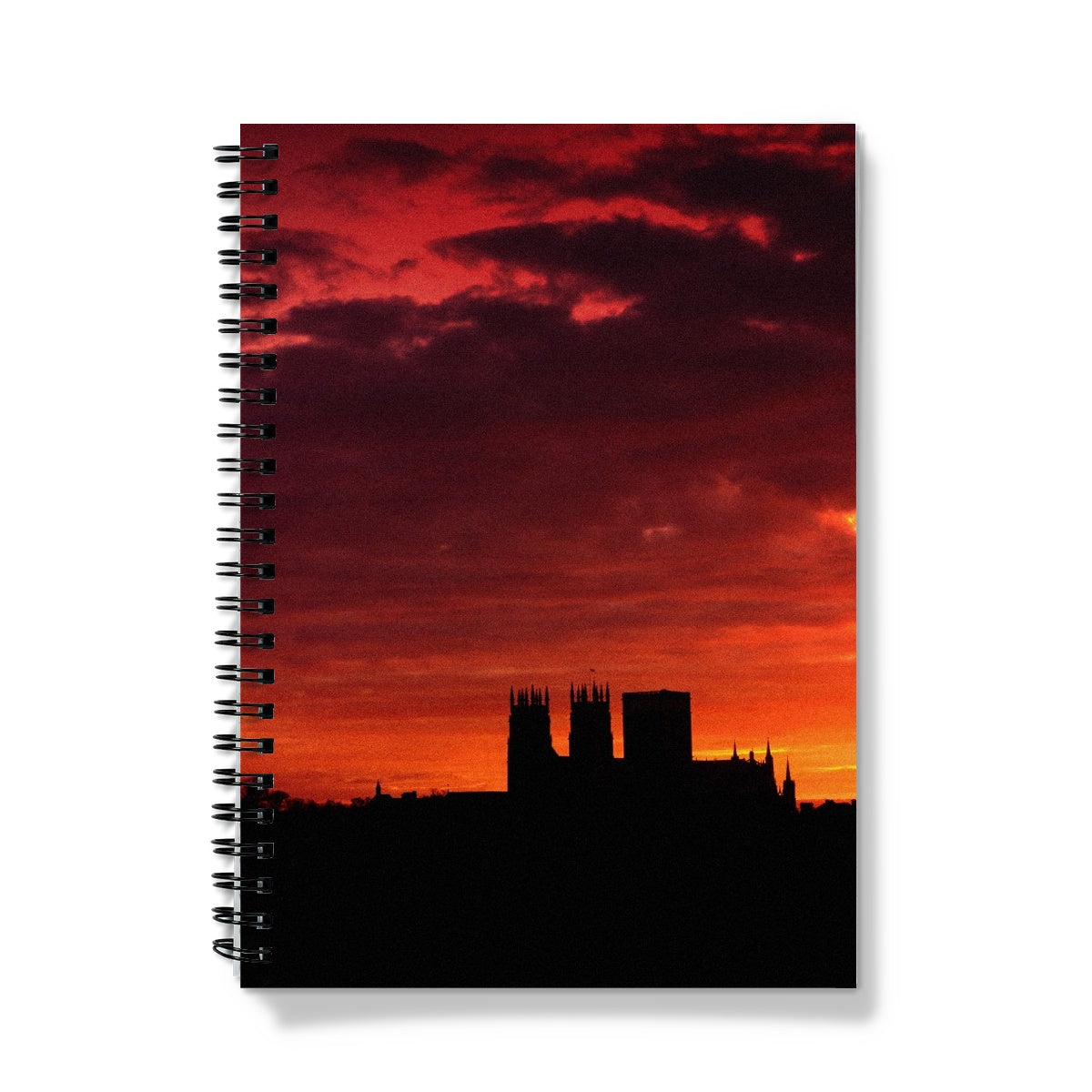 York Minster silhouetted against an orange sky at sunrise Notebook