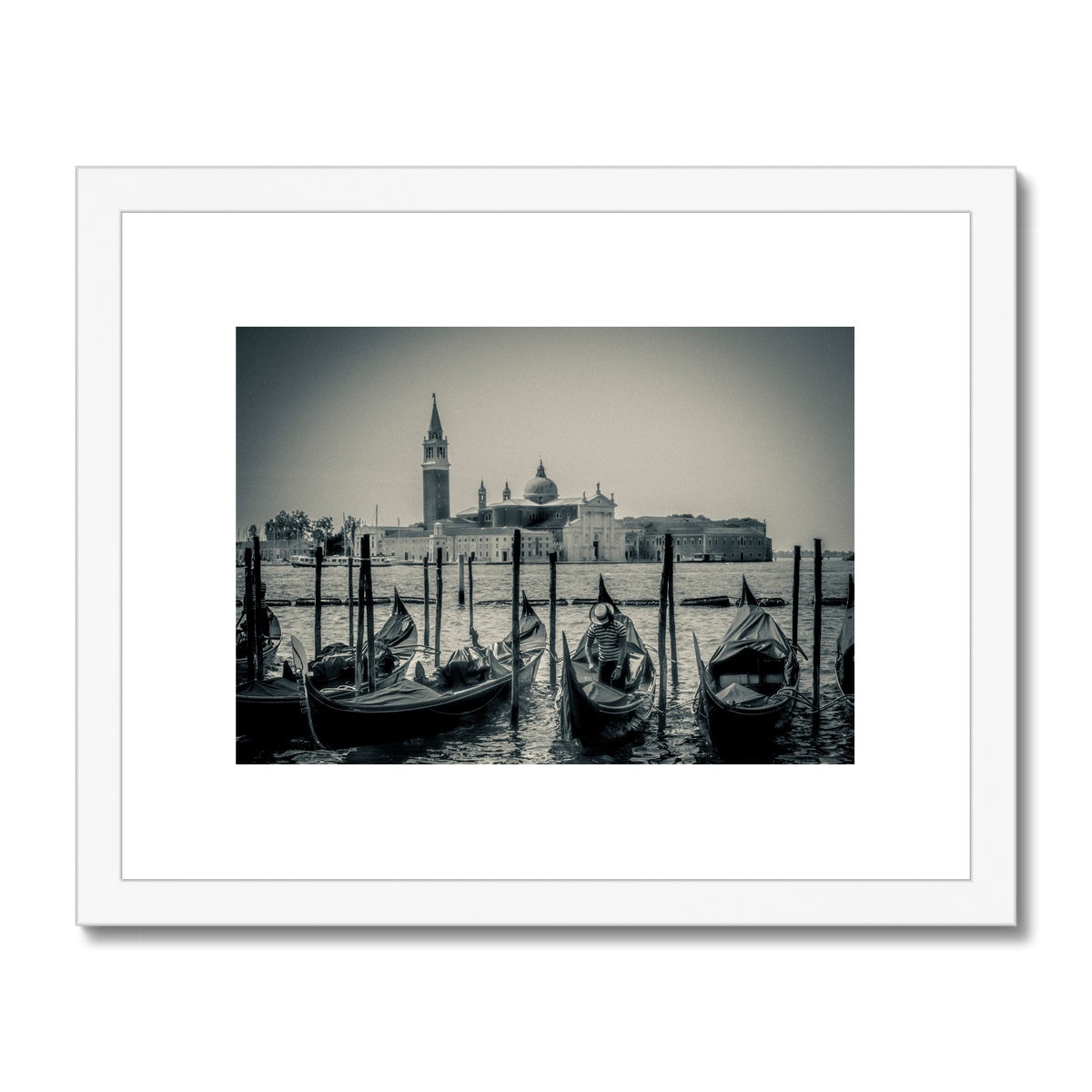 Gondolas moored in St Mark's Basin with San Giorgio Maggiore in the background. Venice, Italy. Framed & Mounted Print