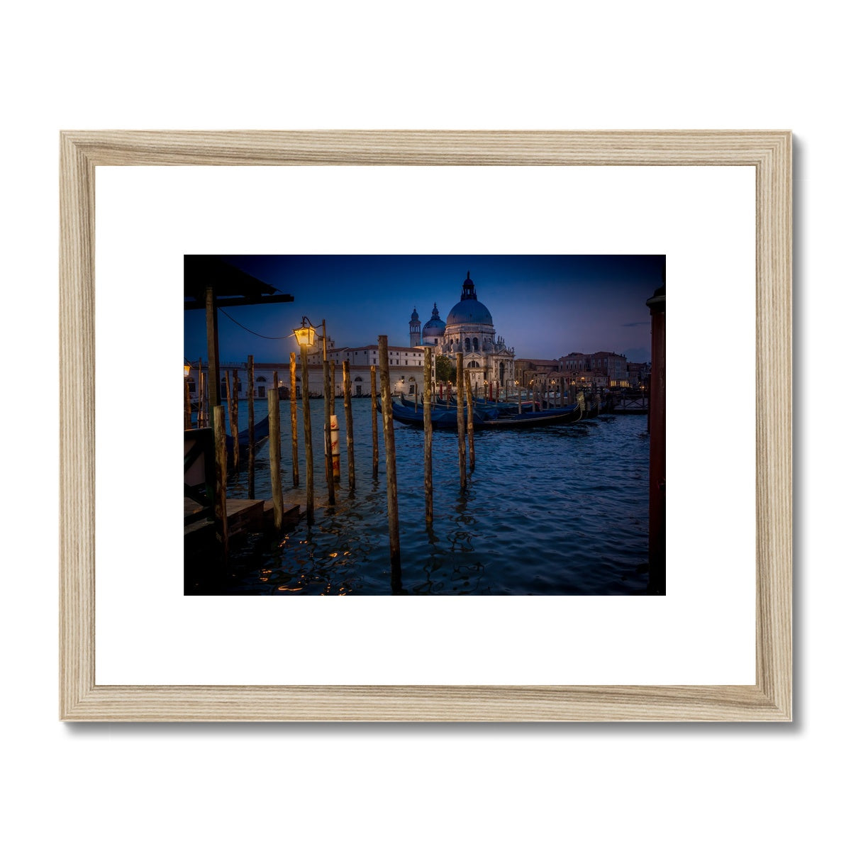 Gondolas moored for the night on the Grand Canal with the church of Santa Maria della Salute in the background. Venice, Italy. - Framed & Mounted Print