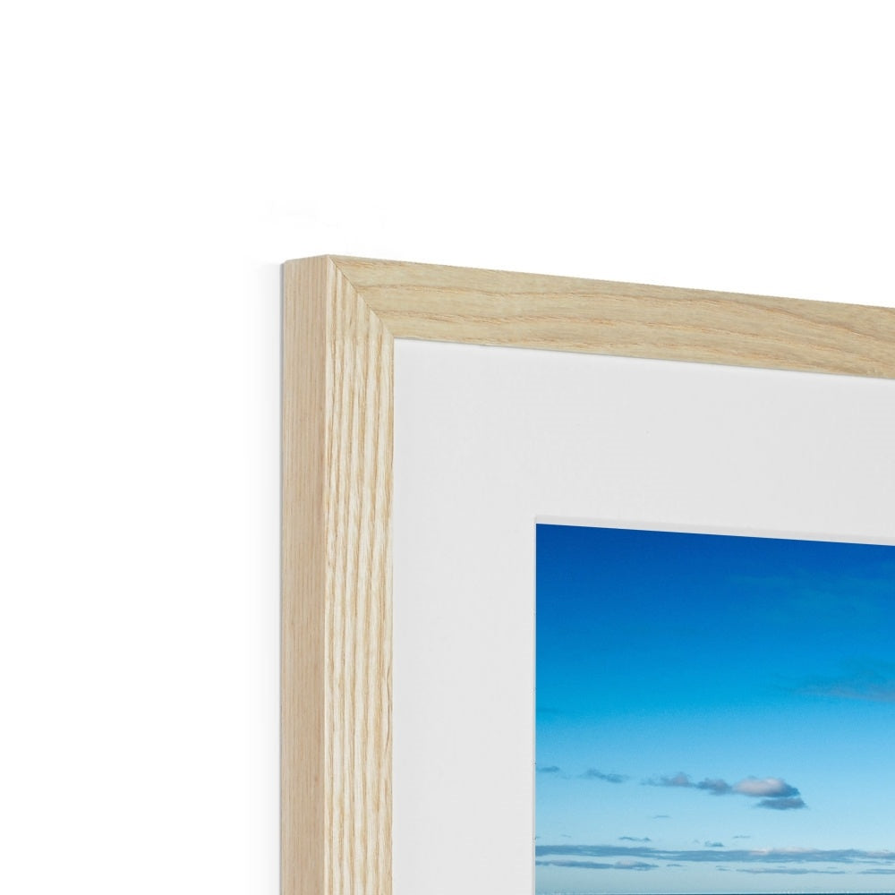 Blackpool's stone stepped sea defences with Blackpool Tower and Central Pier in the distance, Blackpool, UK. Framed & Mounted Print