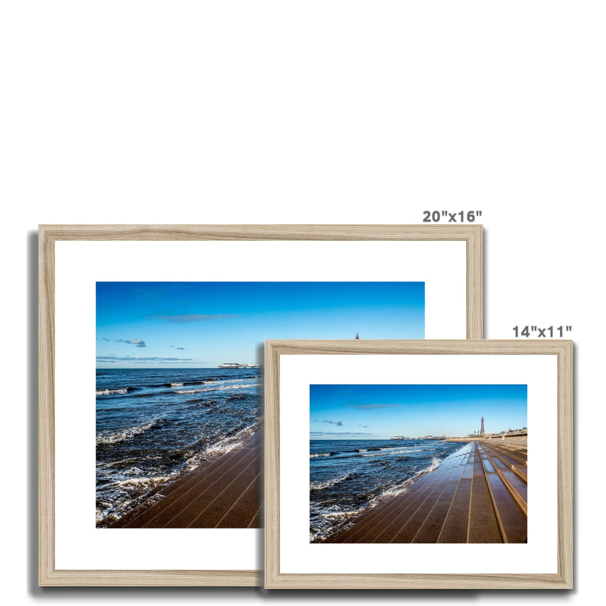 Blackpool's stone stepped sea defences with Blackpool Tower and Central Pier in the distance, Blackpool, UK. Framed & Mounted Print