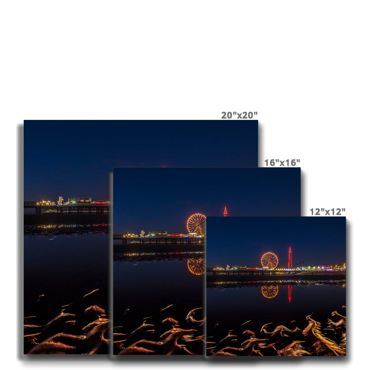 Blackpool Tower and Central Pier at night, with reflection of illuminations in water on the beach  UK. Canvas