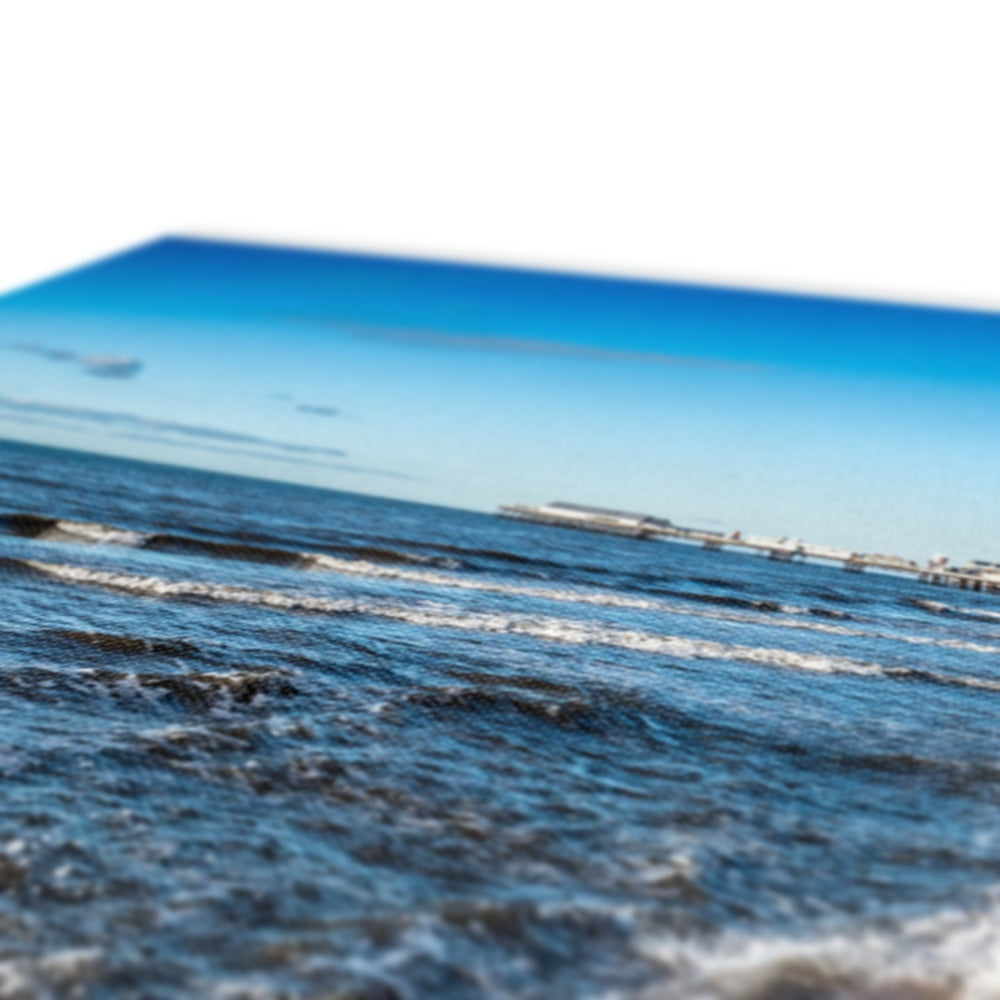 Blackpool's stone stepped sea defences with Blackpool Tower and Central Pier in the distance, Blackpool, UK. Canvas