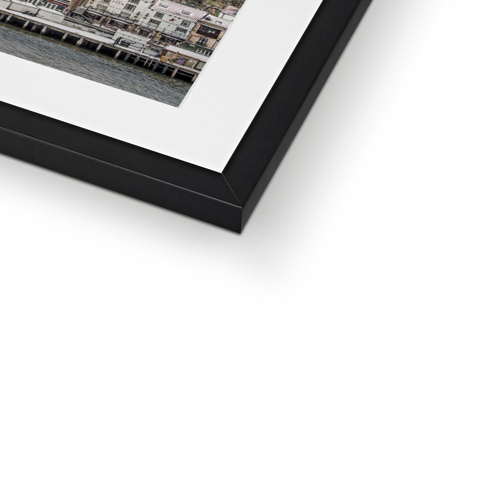 View of Whitby town centre in snow from St Mary's Church, Whitby, UK. Framed & Mounted Print