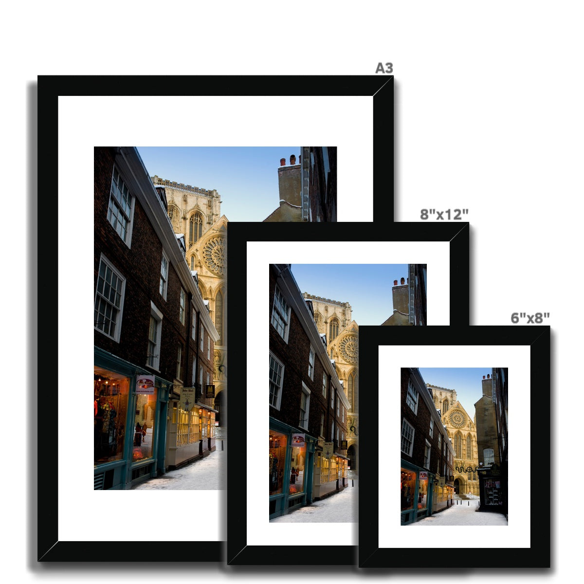 South entrance to York Minster with the Rose window seen from Minster Gates in the snow, York, UK. Framed & Mounted Print