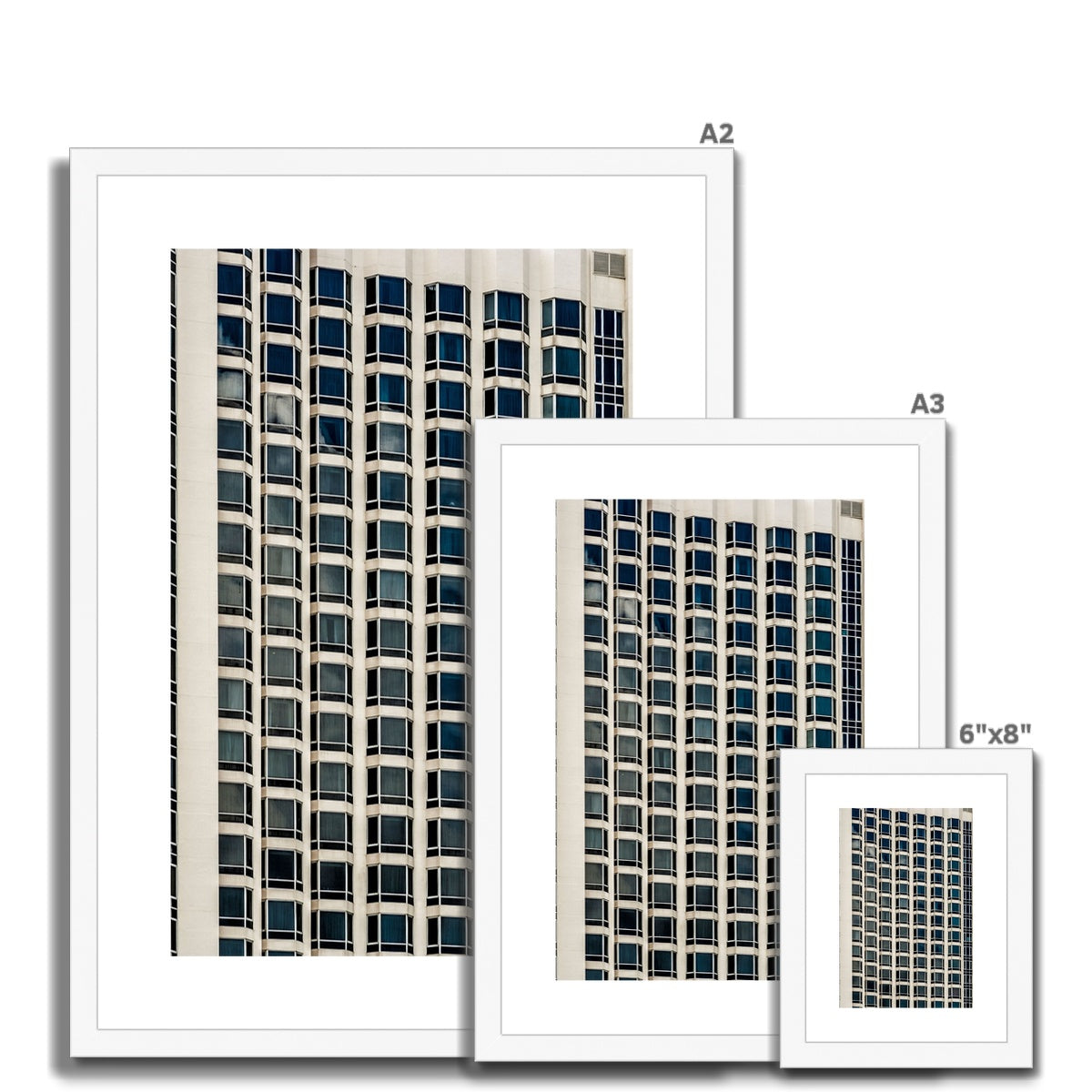 Symmetrical pattern of windows on contemporary skyscraper Framed & Mounted Print