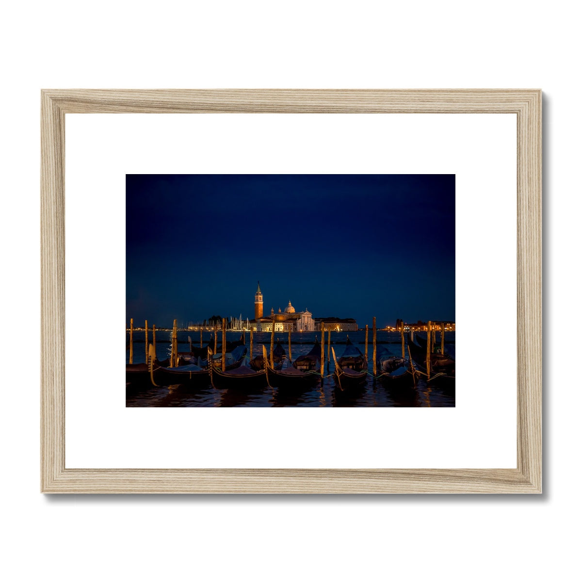 Gondolas moored in St Mark's Basin with San Giorgio Maggiore in the background at night, Venice, Italy. Framed & Mounted Print