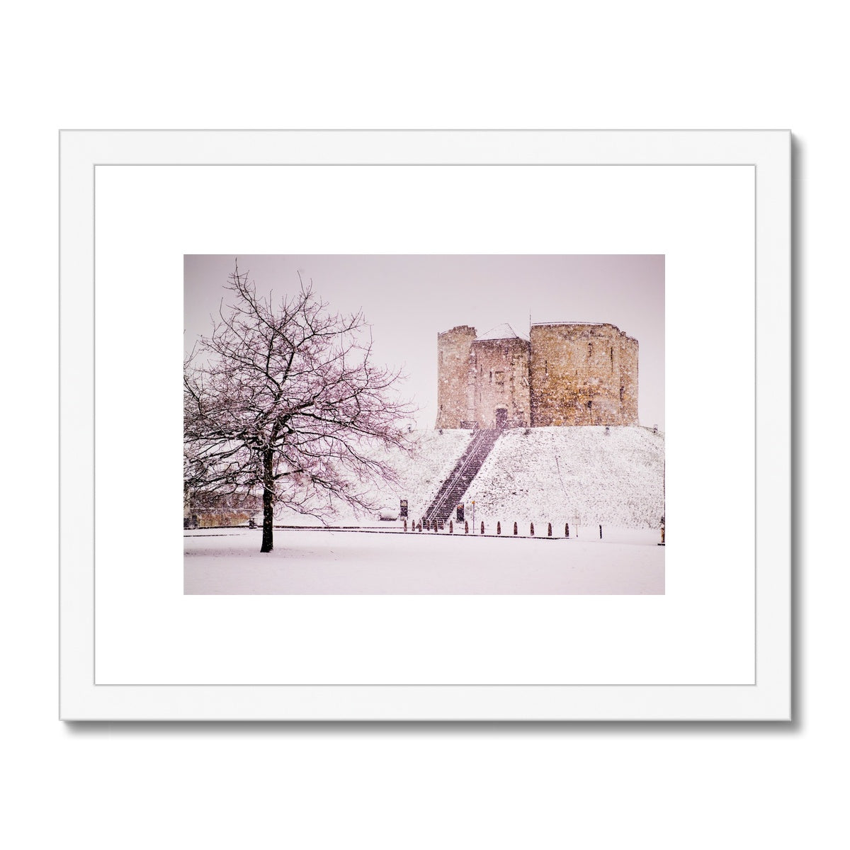Clifford's Tower in snow blizzard, York, UK Framed & Mounted Print