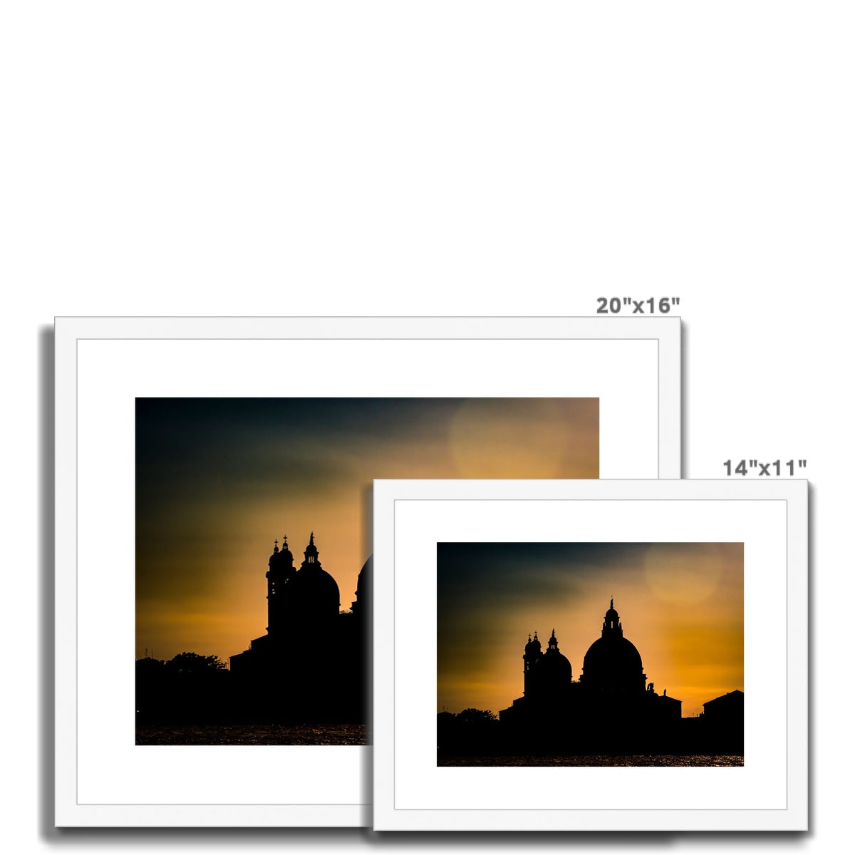 Silhouette of Santa Maria della Salute on the Grand Canal in Venice against a golden sky at sunset. Italy. Framed & Mounted Print