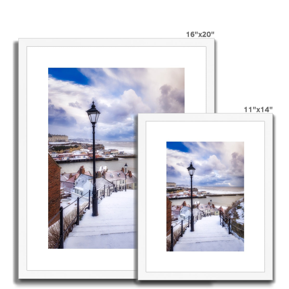 Snow covered steps leading down from St Mary's Church, Whitby, UK. Framed & Mounted Print