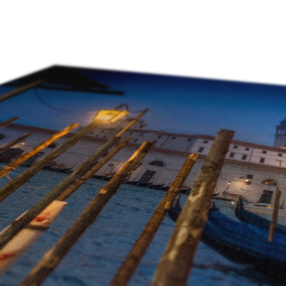 Gondolas moored for the night on the Grand Canal with the church of Santa Maria della Salute in the background. Venice, Italy. - Canvas