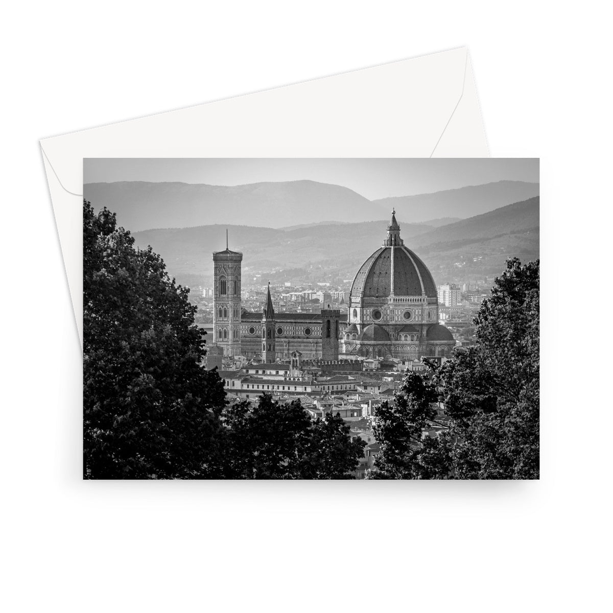 The south façade of Florence Cathedral glimpsed through the trees of San Miniato al Monte. Italy.  Greeting Card