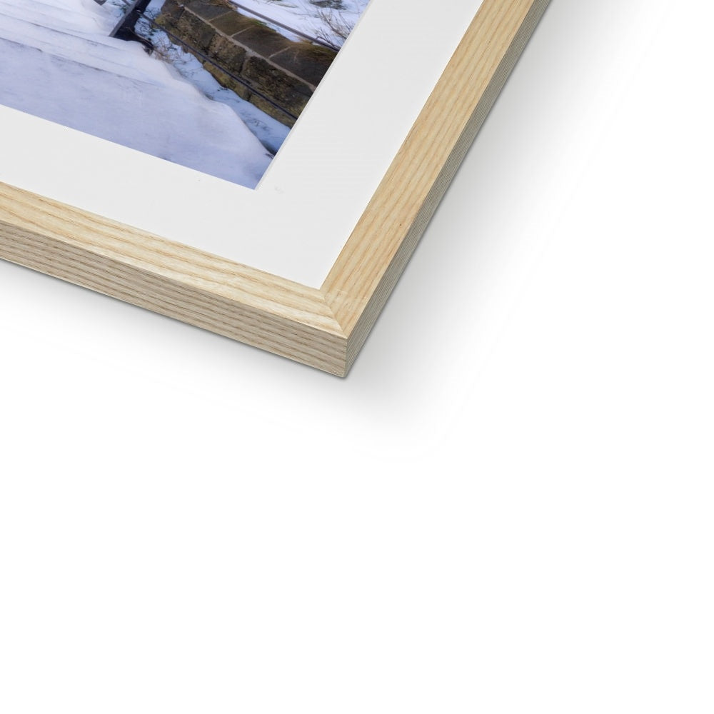 Snow covered steps leading down from St Mary's Church, Whitby, UK. Framed & Mounted Print