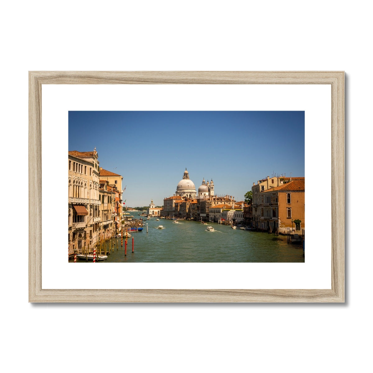 Grand canal in Venice with the domes of the church Santa Maria della  Salute in the distance Framed & Mounted Print