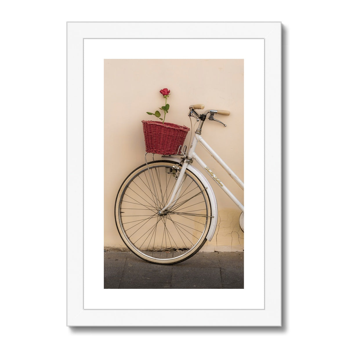 White bicycle parked against a  rendered wall with a red rose in its basket, Rome, Italy. Framed & Mounted Print