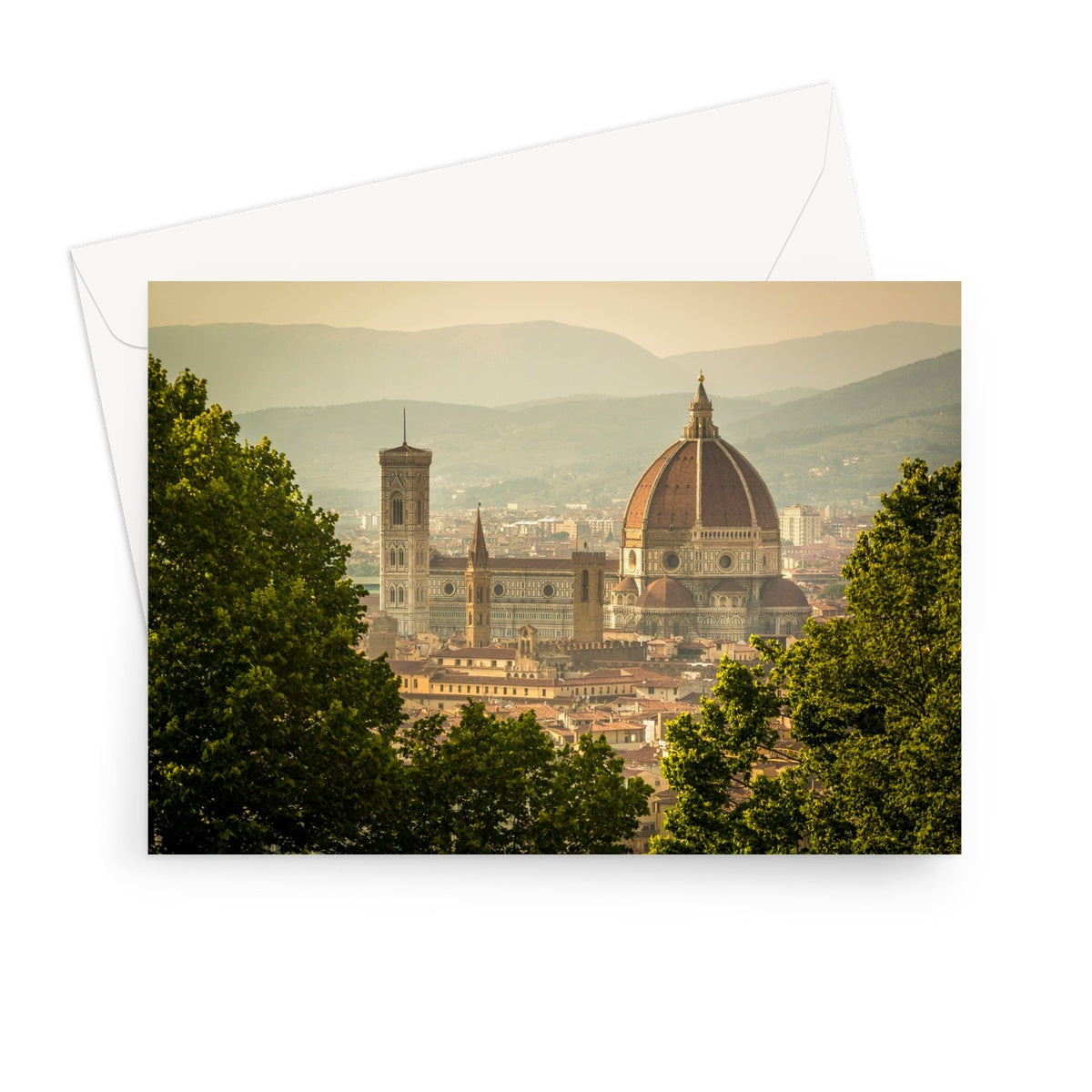 The south façade of Florence Cathedral glimpsed through the trees of San Miniato al Monte.  Italy. Greeting Card