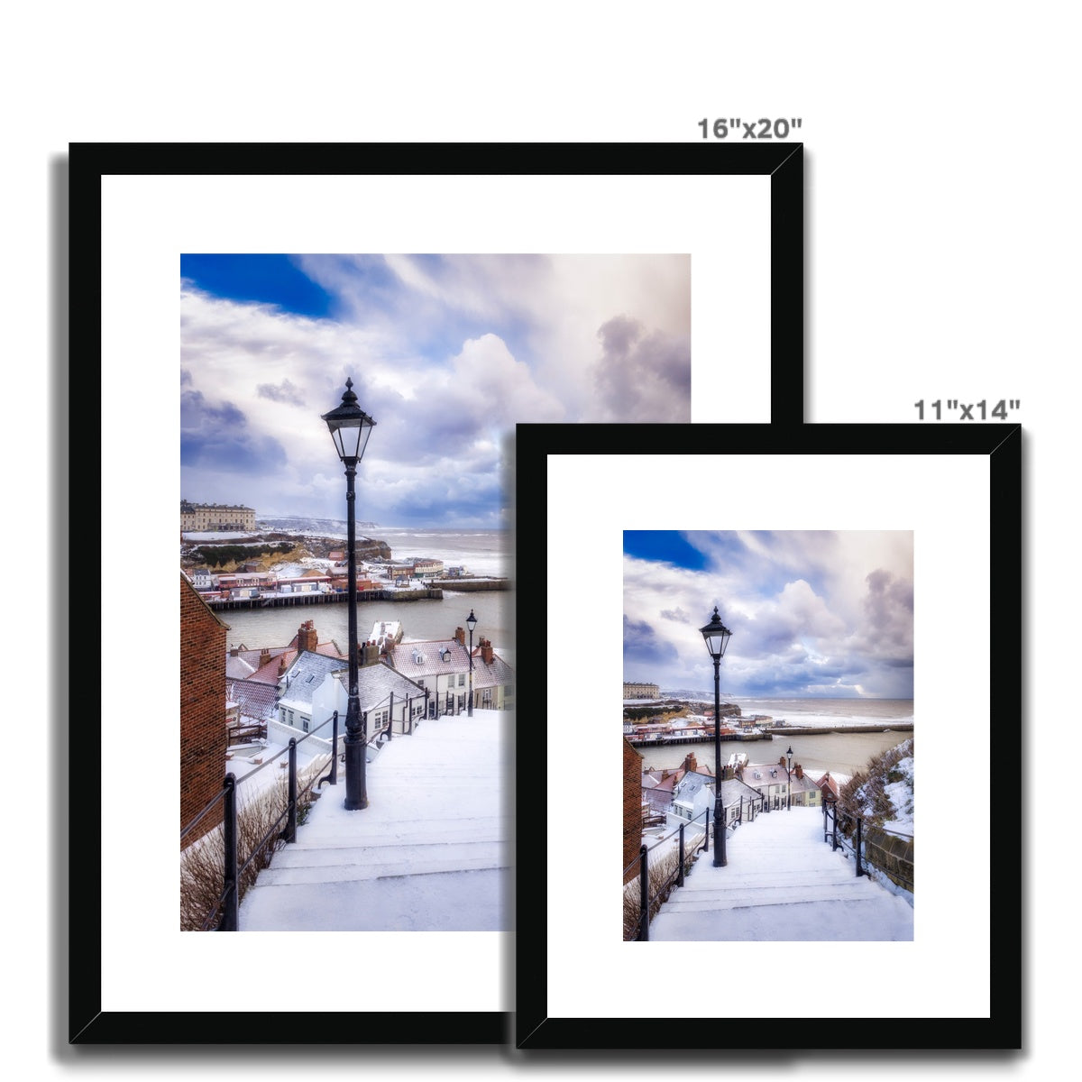 Snow covered steps leading down from St Mary's Church, Whitby, UK. Framed & Mounted Print