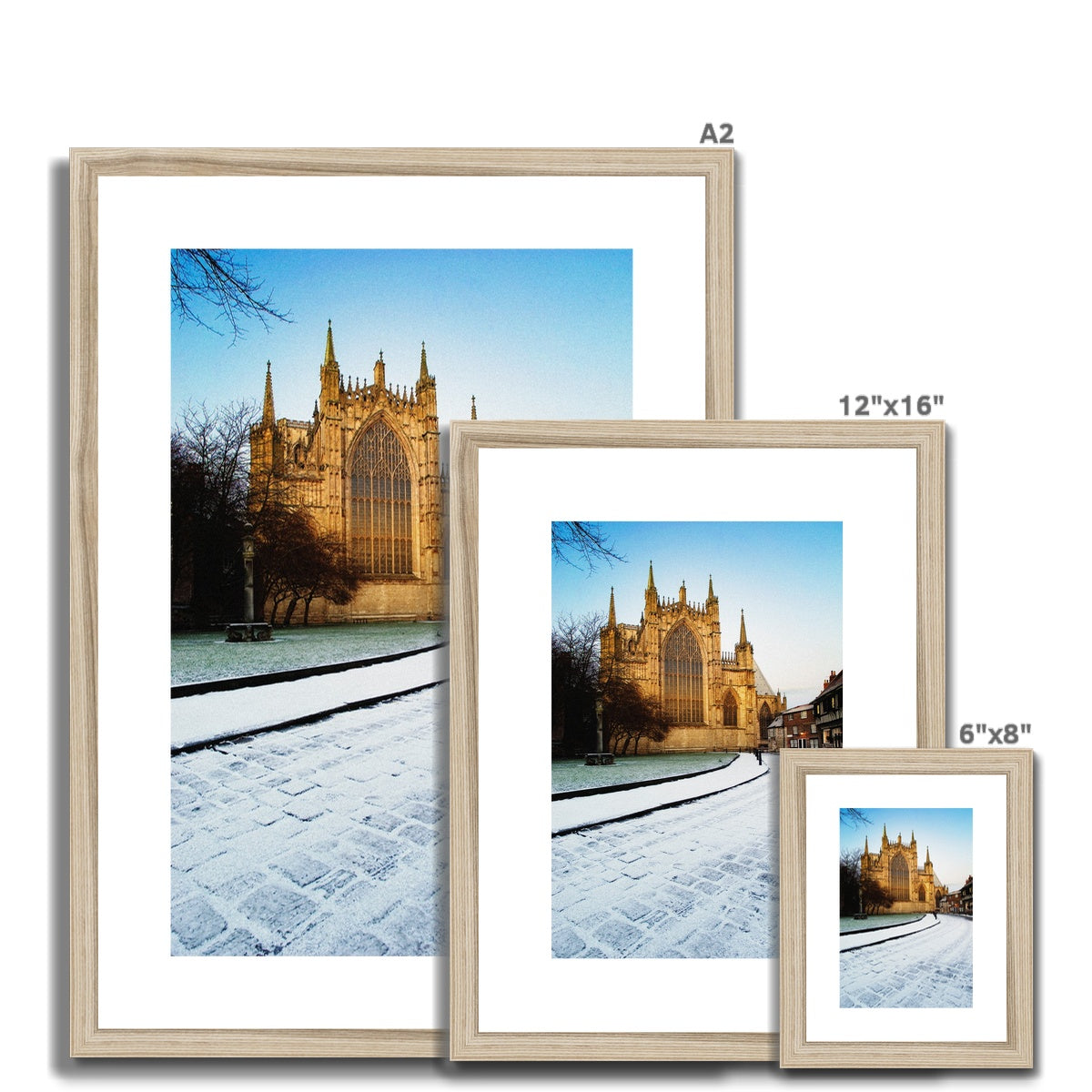 York Minster with College Green and College Street in the snow, York, North Yorkshire, UK Framed & Mounted Print
