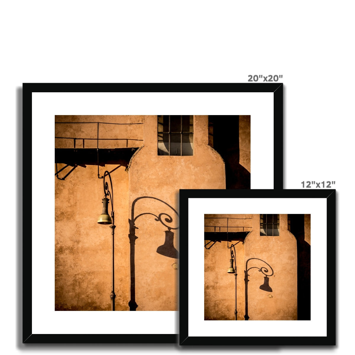 Street lamp and shadow on rendered building wall, Rome, Italy. Framed & Mounted Print