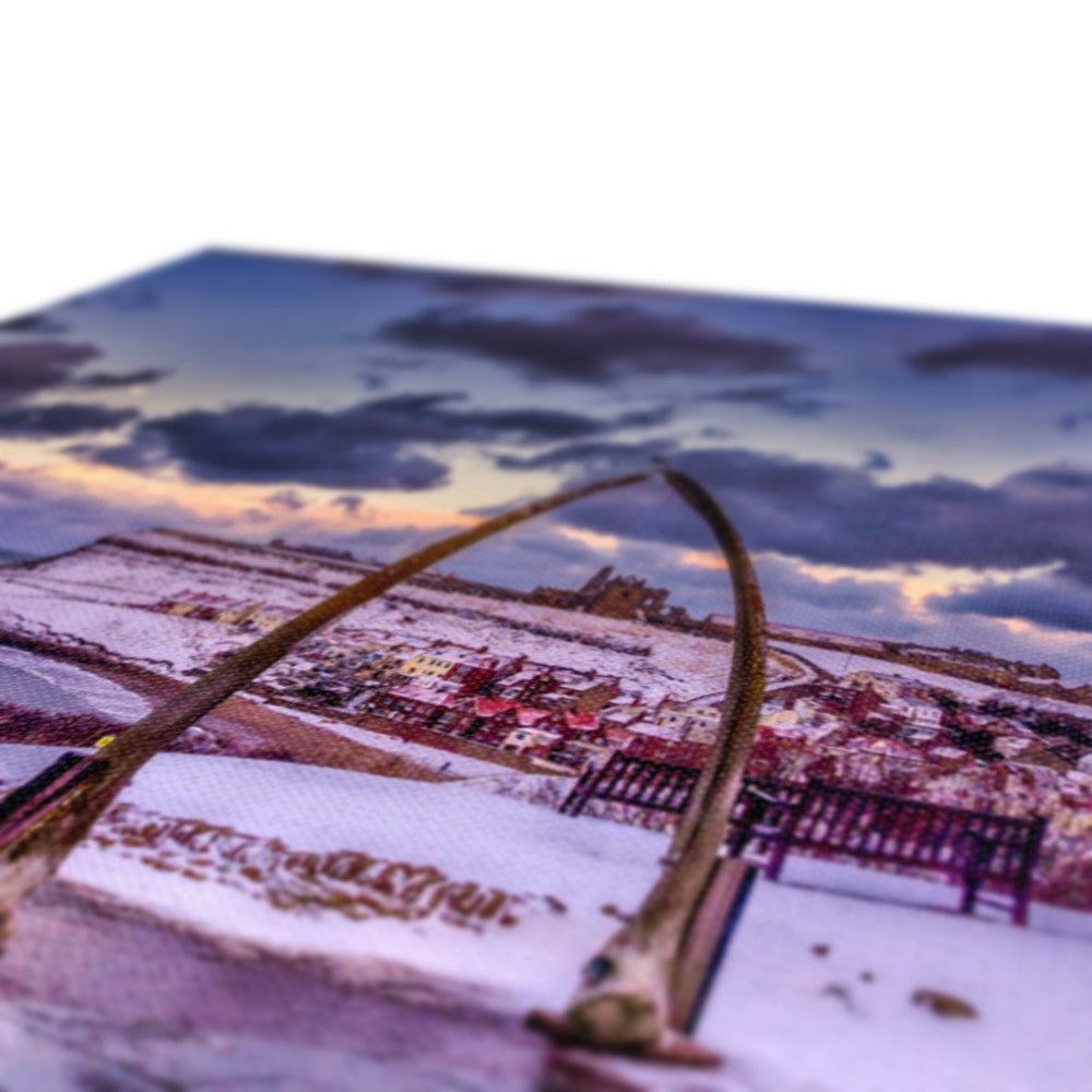Whalebone Arch and view of Whitby Abbey in snow, Whitby, UK. Canvas