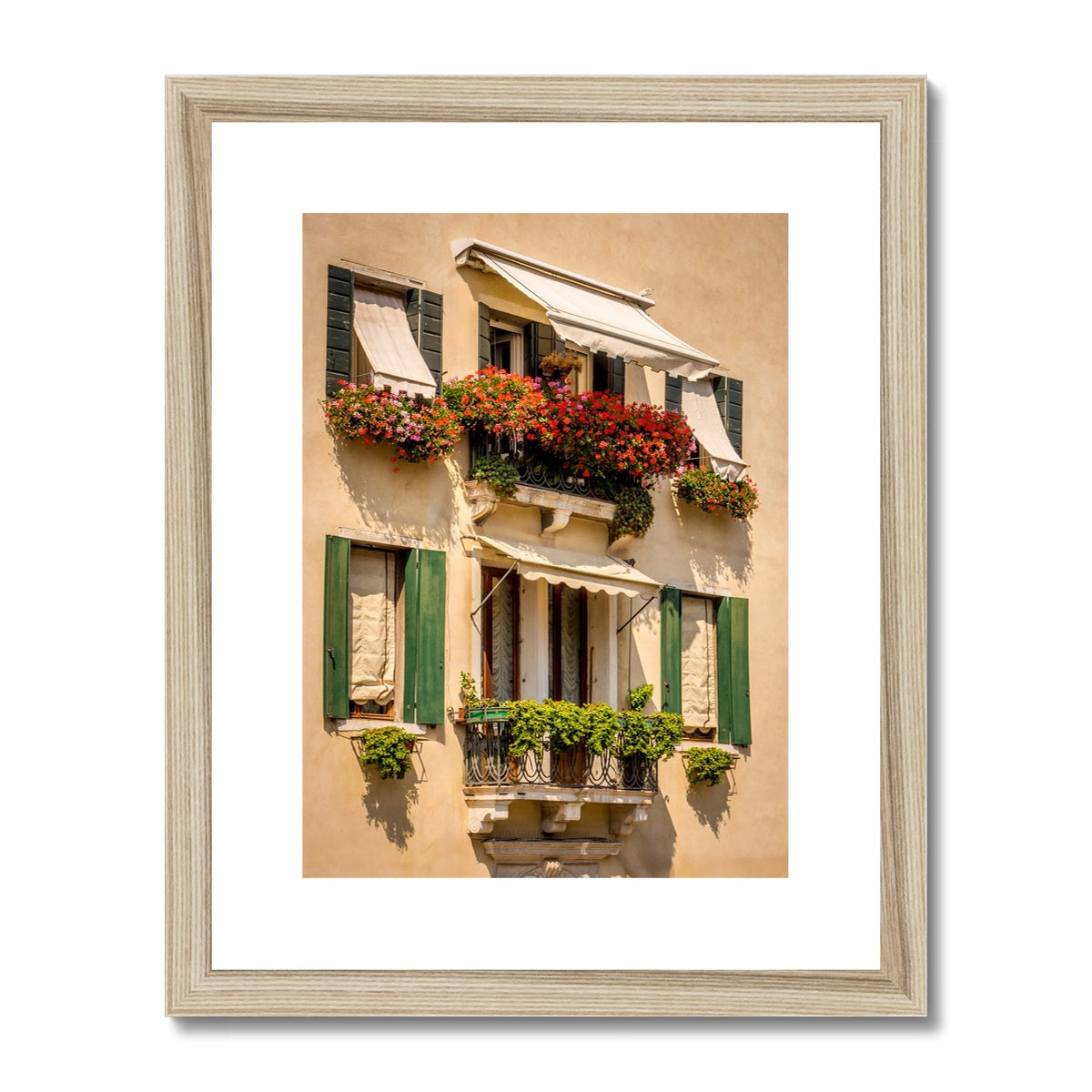 Traditional canal-side cream-rendered house with shuttered windows and window boxes. Venice. Italy. Framed & Mounted Print