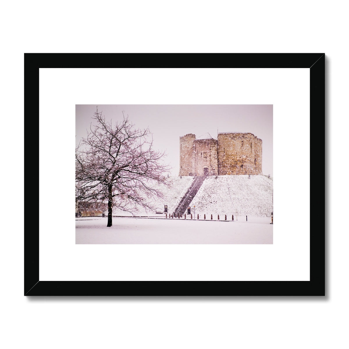 Clifford's Tower in snow blizzard, York, UK Framed & Mounted Print