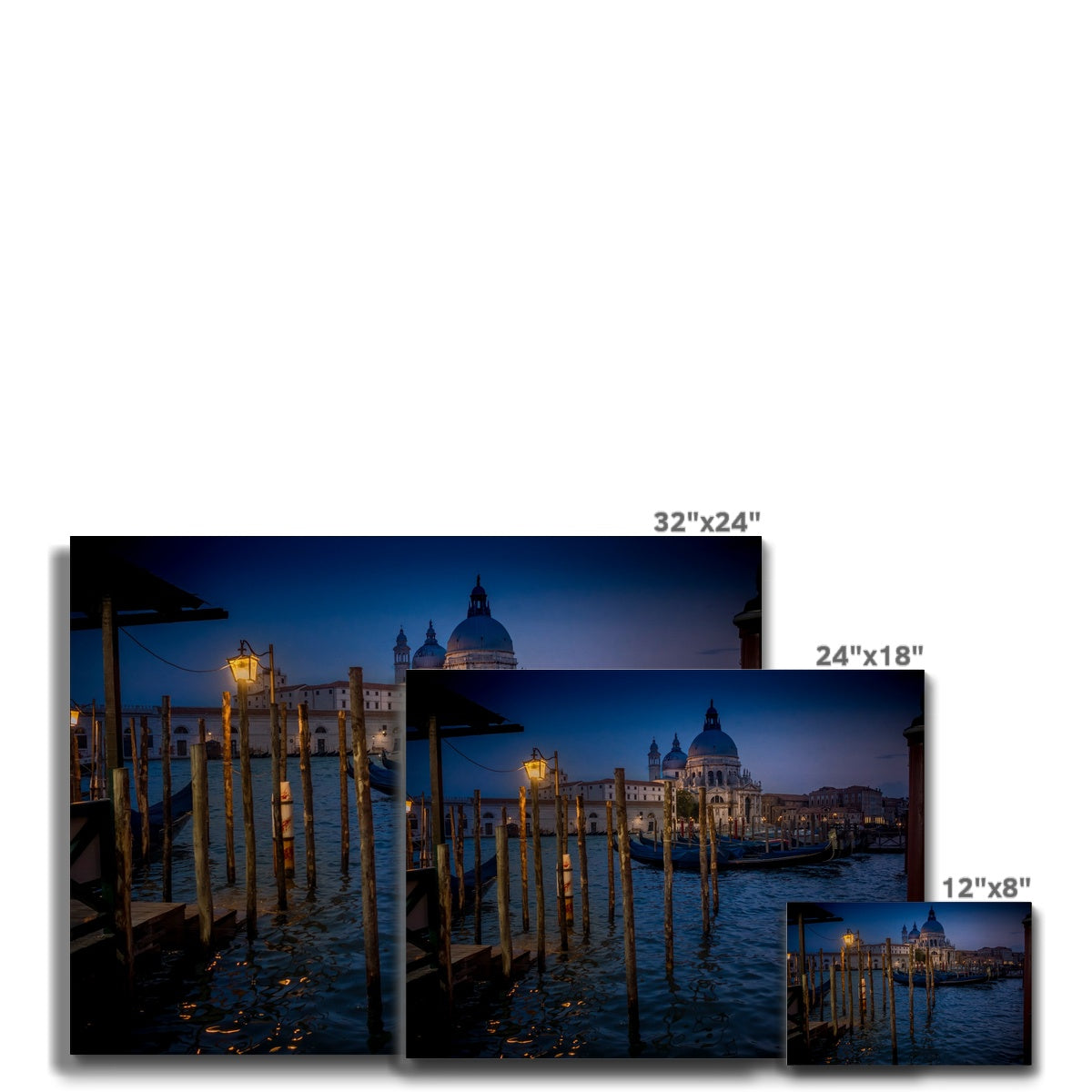 Gondolas moored for the night on the Grand Canal with the church of Santa Maria della Salute in the background. Venice, Italy. - Canvas