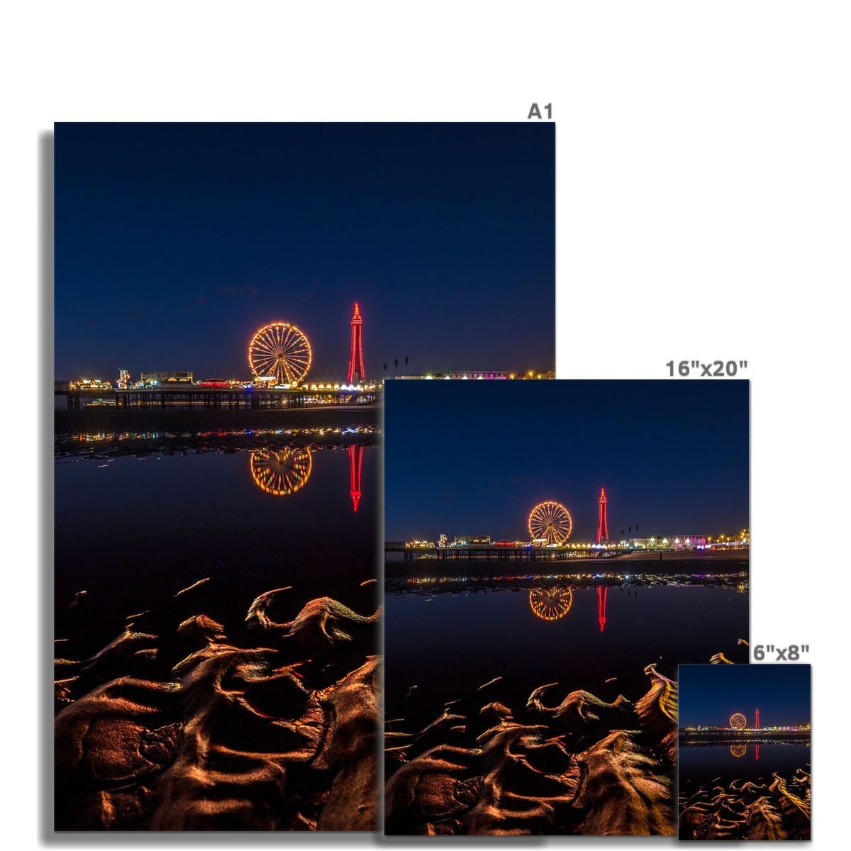 Blackpool Tower and Central Pier at night, with reflection of illuminations in water on the beach  UK. Fine Art Print